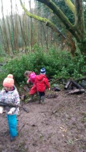 small children dressed warmly playing outdoors