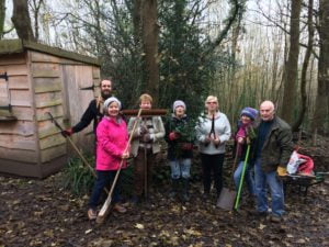 Group of volunteers in front o f a shed at Arnos Vale Cemetery