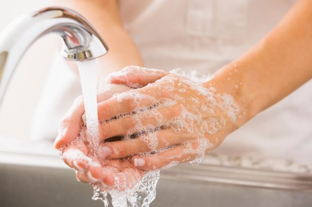 Washing hands in water with soap