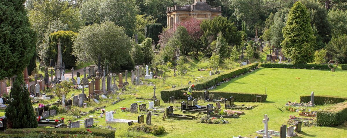 Volunteers strimming on Ceremonial Way at Arnos Vale Cemetery - image by Buffy Jones
