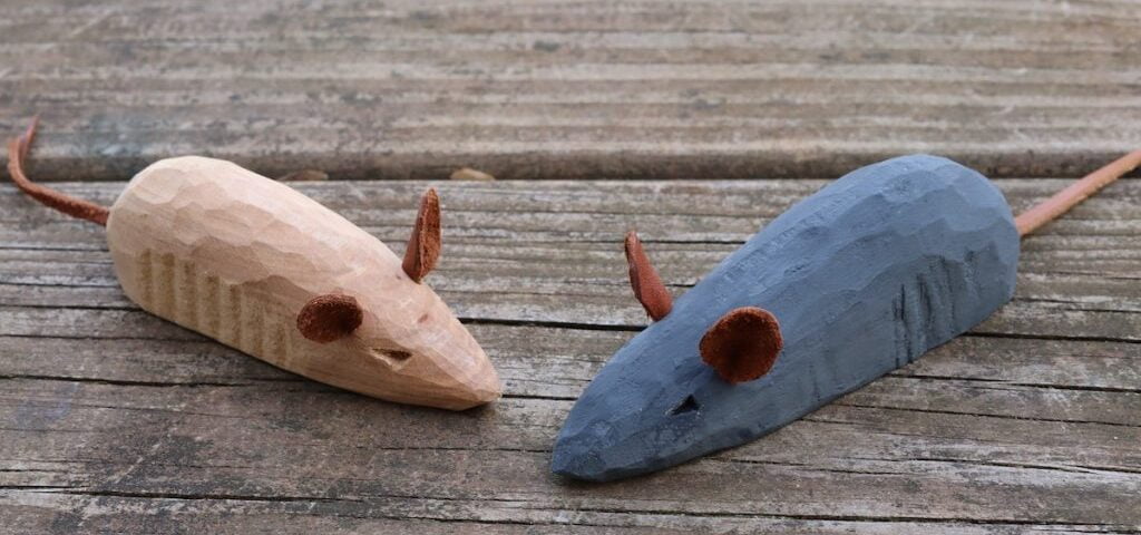 A wooden hand carved mouse