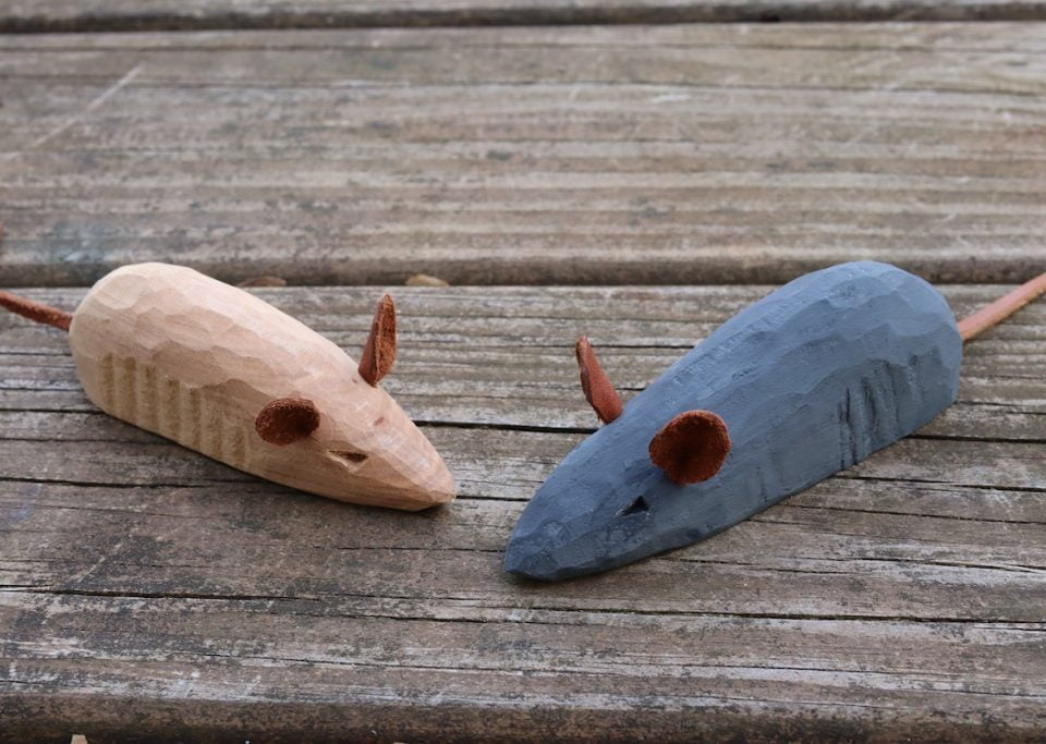 A wooden hand carved mouse