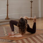 Woman in a yoga pose in the Anglican Chapel