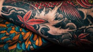 Post-Mortem Tattoo Preservation – online talk. a close up of a person with tattoos on their arm