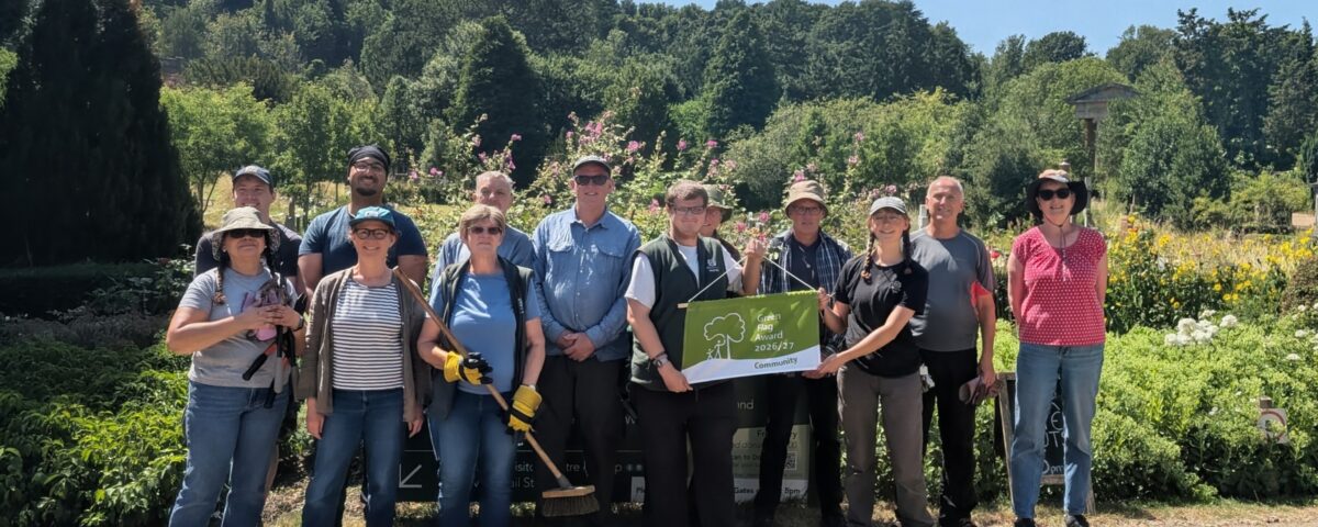 Volunteers at Arnos Vale Cemetery with the Green Flag Community Award