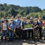 Volunteers at Arnos Vale Cemetery with the Green Flag Community Award